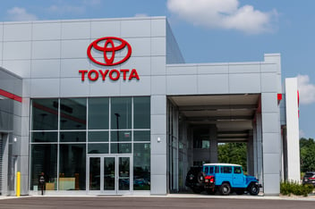 Toyota motor corporation logo on dealership building